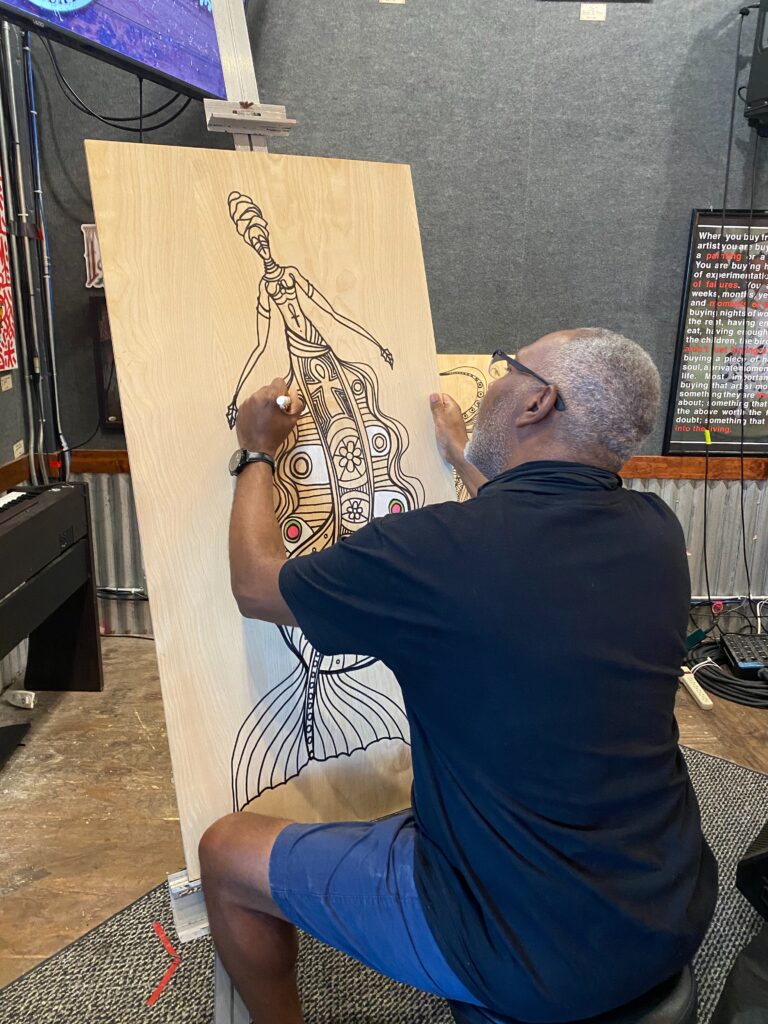 Artist Anthony Burks creating live